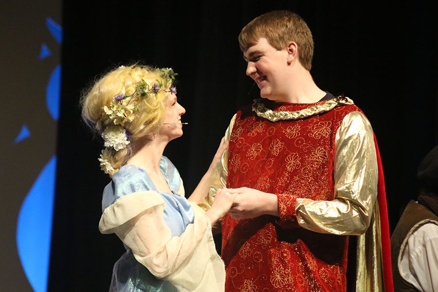 The Prince, played by senior Quinn Sheehan, holds Rapunzel, played by senior Diana Auckly, after ending up together.