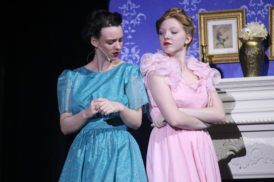 After fighting, Cinderella's Stepsisters, played by junior Alison Booth and sophomore Allison Schein, look at each other.