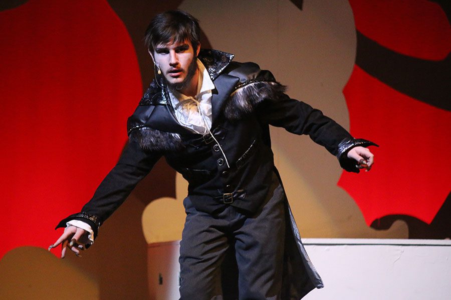 The Wolf, played by junior Jayden Moore, dances off stage after "Hello, Little Girl."