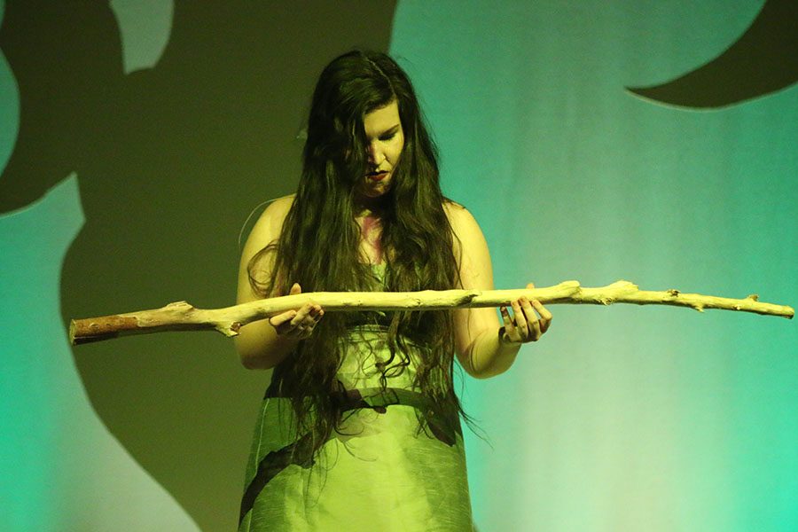 After failing to cast a spell over Rapunzel and her Prince, the Witch, played by junior Lauryn Hurley, looks at her stick.