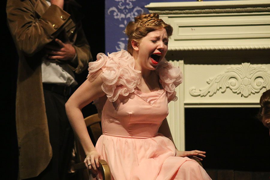 After having her foot cut to fit into the shoe, Cinderella's Stepsister, played by sophomore Allison Schein, screams.