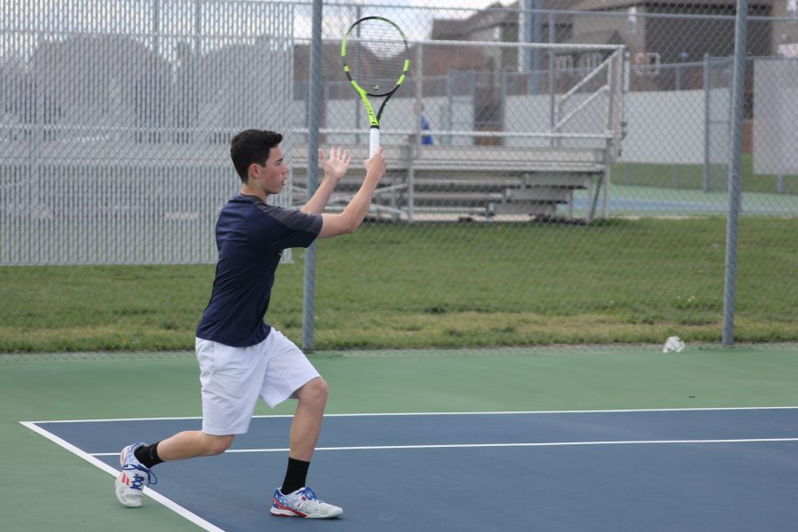 Rushing forward, sophomore Eric Schanker goes to replace his counterpart on the court.