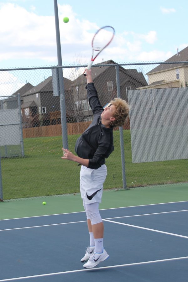 Junior Dante Peterson viciously jumps to receive a ball way over his head.