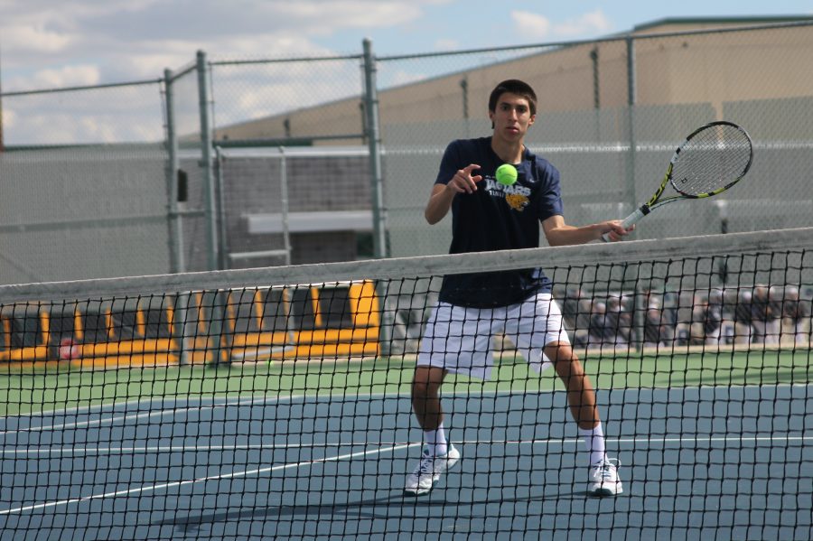 Senior Andrew Bock indicates that he will take the next shot.