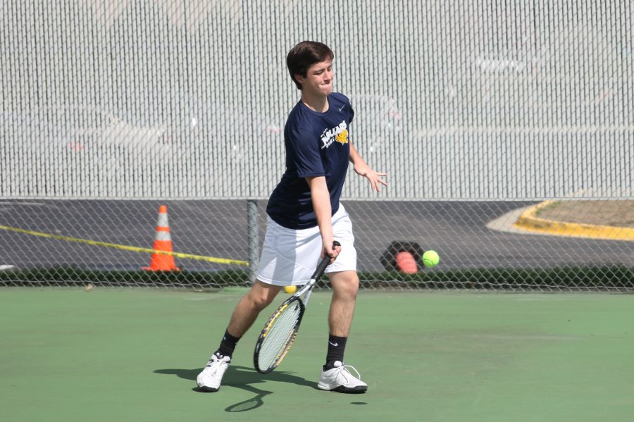 With a strong swing, freshman Joey Gillette receives the ball.