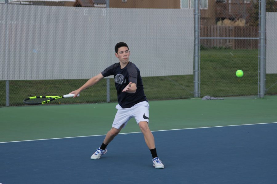 In a successful receive, sophomore Eric Schanker powerfully returns the ball on Thursday, April 6.