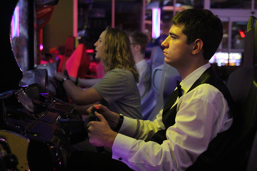 Junior Jack Ball plays the Batman Arcade game at after prom on Saturday, April 29.