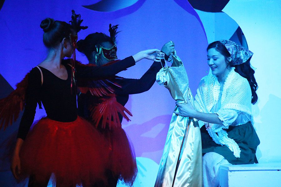Cinderella, played by senior Natalie Carrera, receives a golden gown from the birds.