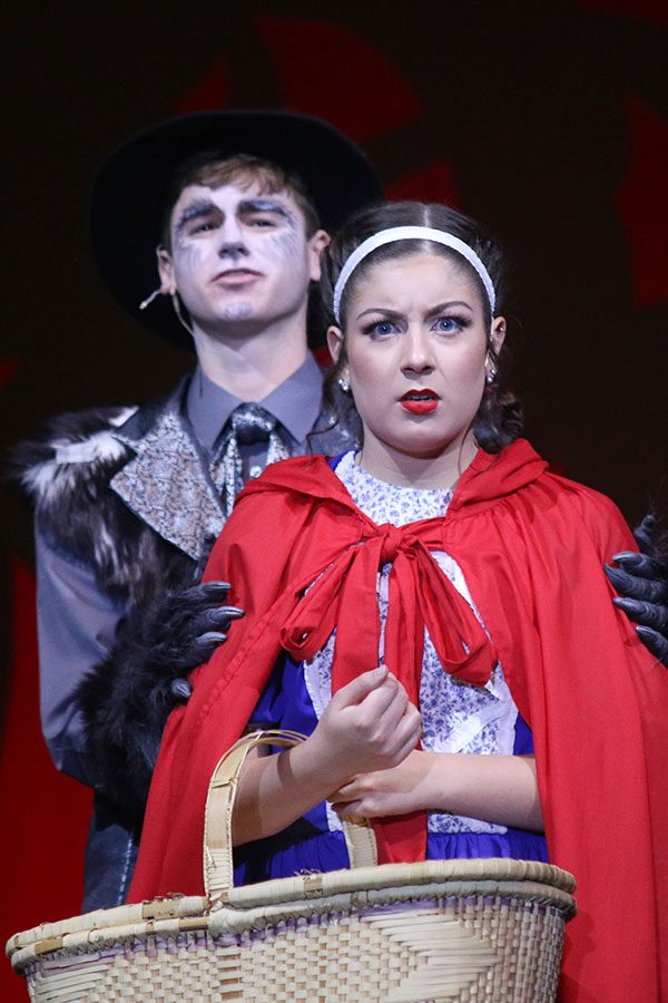 During "Hello, Little Girl", the Wolf, played by Senior Lance Marx, holds Little Red Riding Hood, played by senior Kara Mason.