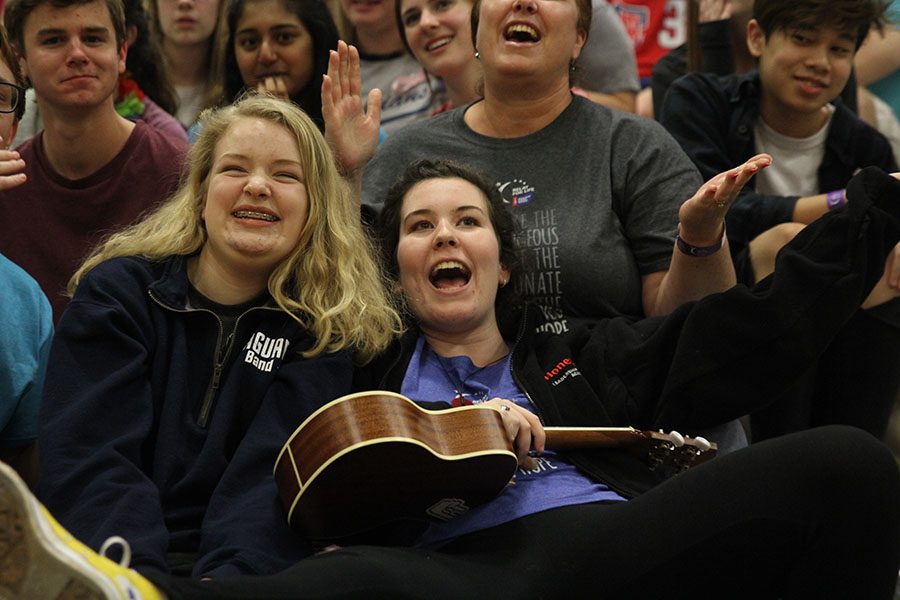 Juniors Katie Mcnaughton and Lauryn Hurley participate in open mic night.