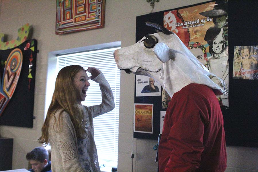 After turning around, senior Diana Auckly is shocked to find drama teacher Jon Copeland wearing a cow head from an Into the Woods costume. I knew there was going to be a cow suit, but I was worried that it  might be funny looking, Auckly said. It actually looks really good.