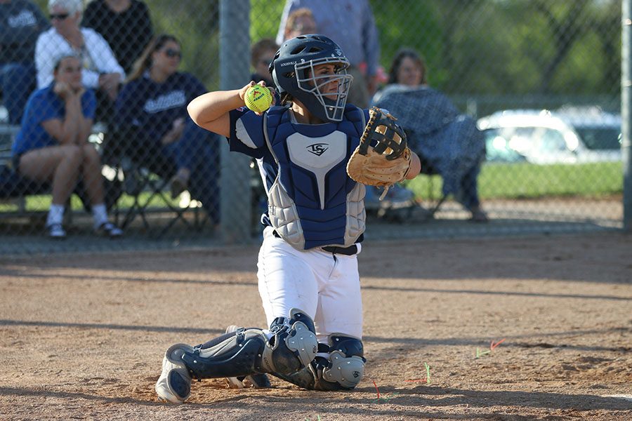 After catching the ball, freshman Jessica Garcia prepares to throw the ball to the pitcher.