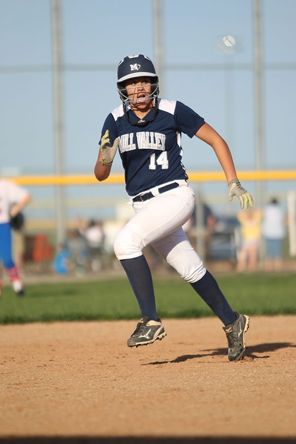 Freshman Lauren Florez runs from second base.