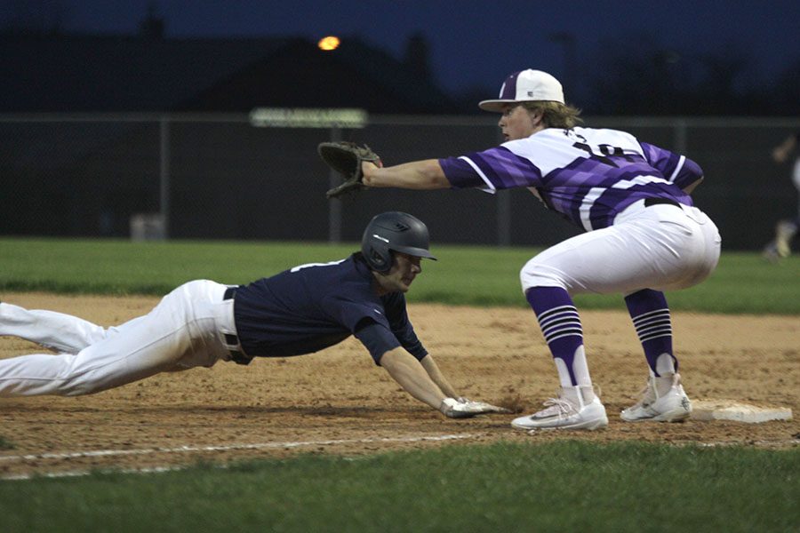 After a 4-3 win over Blue Valley Northwest, the Jaguars lose their second game 5-1 on Friday, April 7. Leading off first base, senior Luke Sosaya slides back to avoid getting tagged out.

