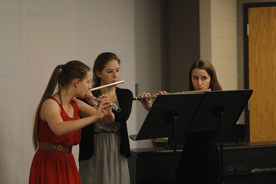 Performing at the band regional competition, the flute trio of sophmore Jordyn Allen, senior Lauren Tracht and junior Madeline Myrick play the song Fairy Dance.