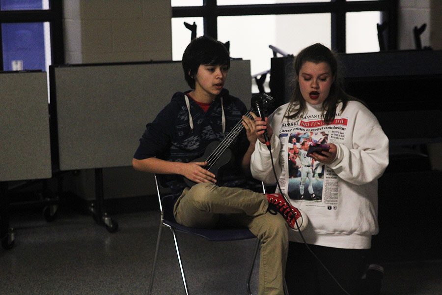 Singing along to Lucy in the Sky with Diamonds, sophomores Allen Vilchis and Lindsey Edwards perform a duet at the Open Mic Night on Thursday, April 12.