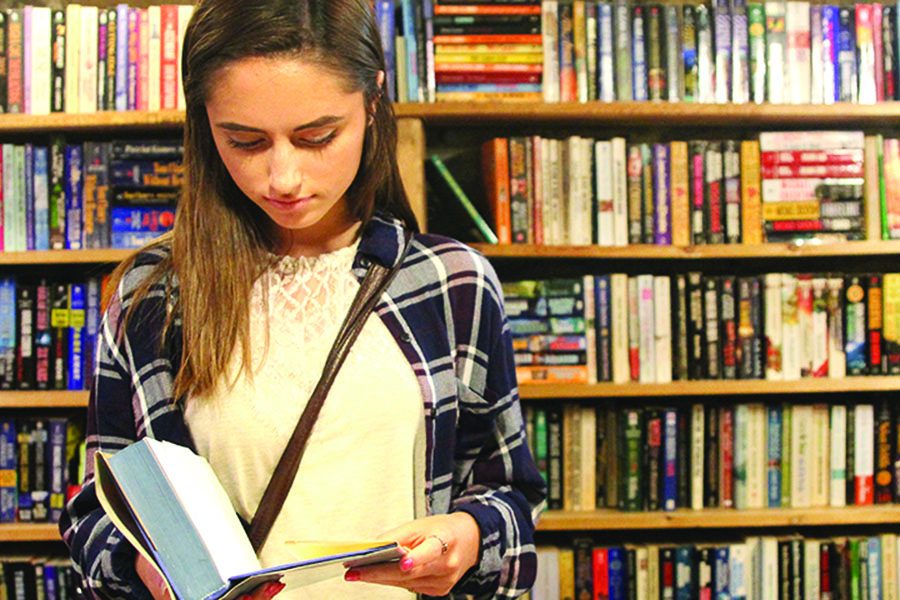 While in Prospero’s Books in Westport, sophomore Paige Nentwig reads one of the many books. “I enjoy Prospero’s books because I love to read,” Nentwig said. 