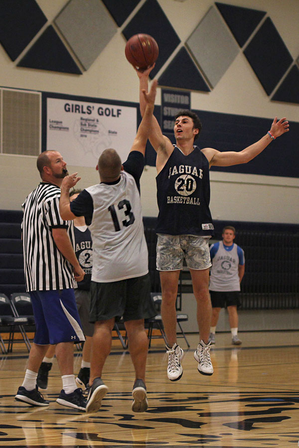 During the tip-off, senior Blake Montgomery gains possession of the ball.