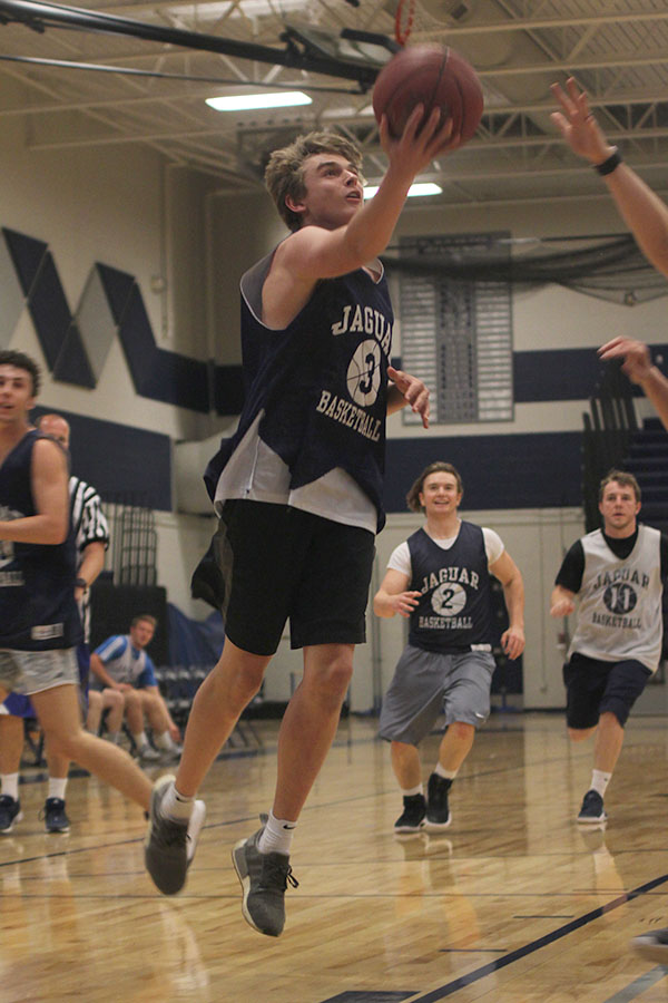 Senior Jack Cooper goes for a lay up. 