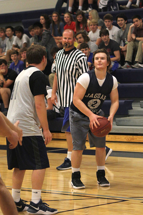 Senior Josh Winscott looks to shoot the basketball. 