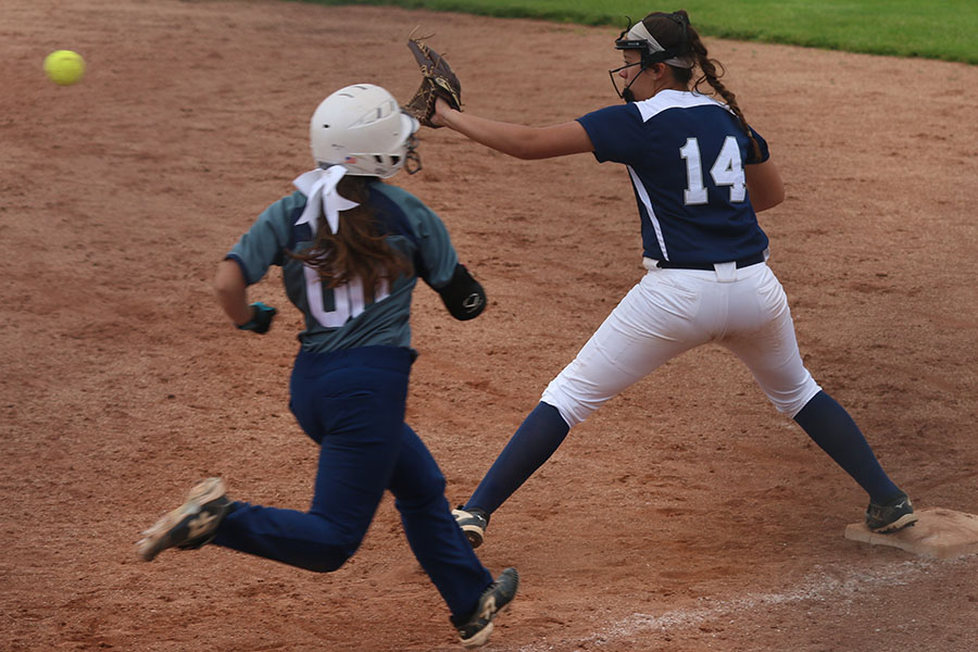 Standing on first base, freshman Lauren Florez looks to catch the ball so she can get an out