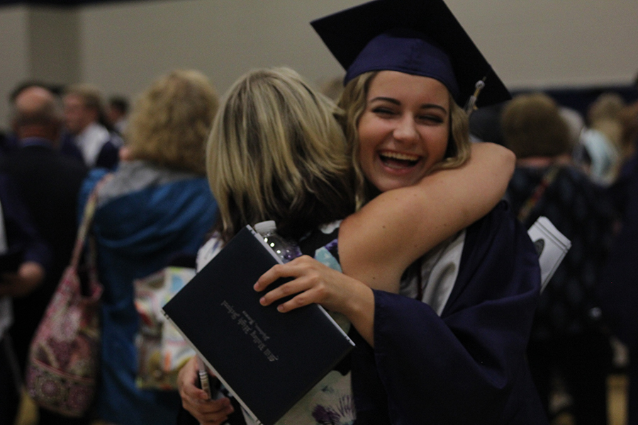 Senior Sophie Rosen and her mother embrace after graduation. 