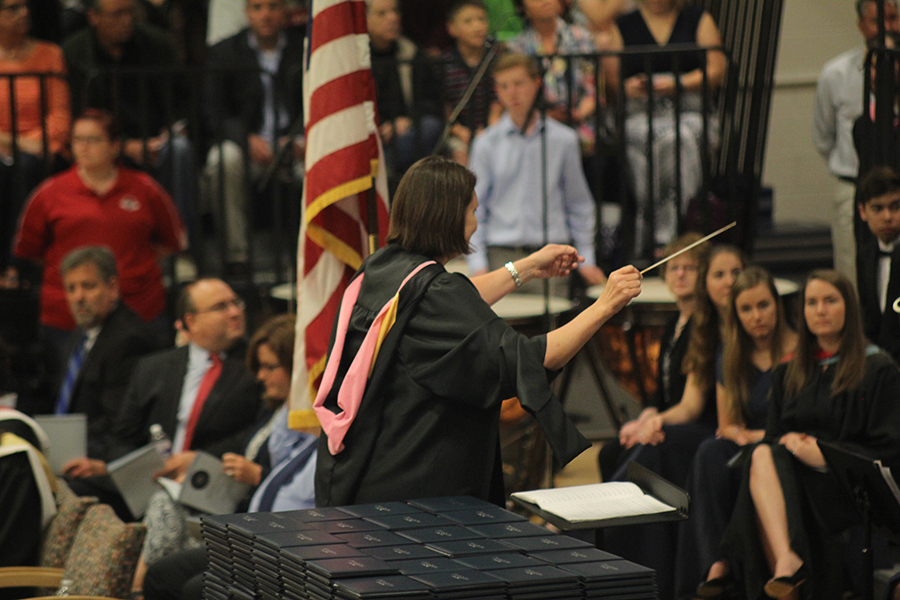 Band teacher Debra Steiner conducts the band. 