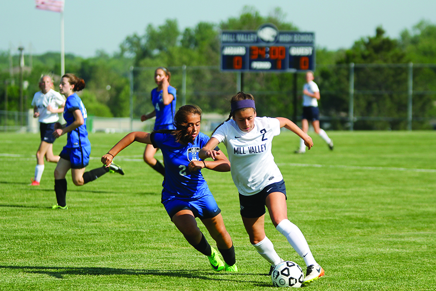 Early in the game, senior Haley Freeman drives forwards against a Leavenworth defender in an attempt to get a shot on goal.