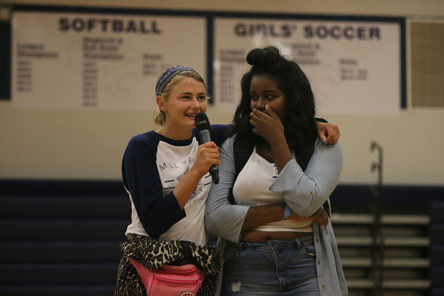 Senior Bella Hadden congratulates a freshman for winning rock paper scissors.