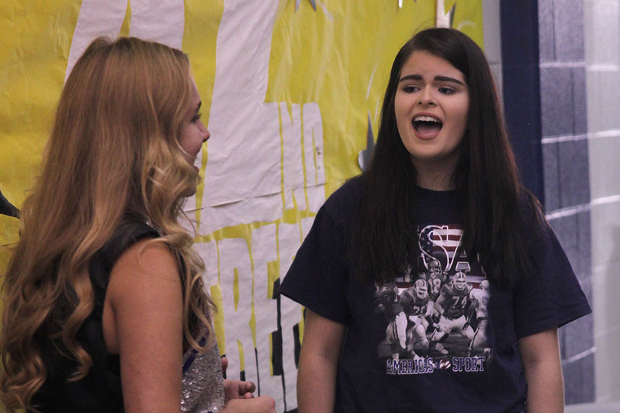 Seniors McKenna Harvey and Elaina Smith perform a duet for their peers on Friday, Sept. 1.