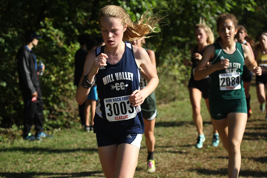 Halfway through the race, freshman Molly Ricker leads a pack of runners at the Rim Rock race on Saturday, Sept. 23.