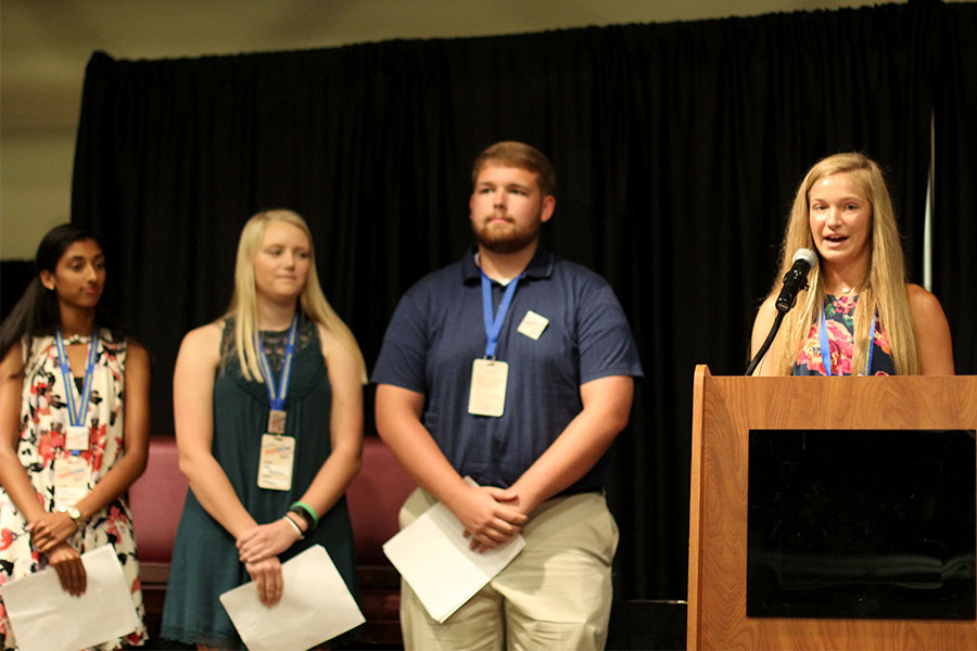 Pittsburg High School students give speeches at the conference.