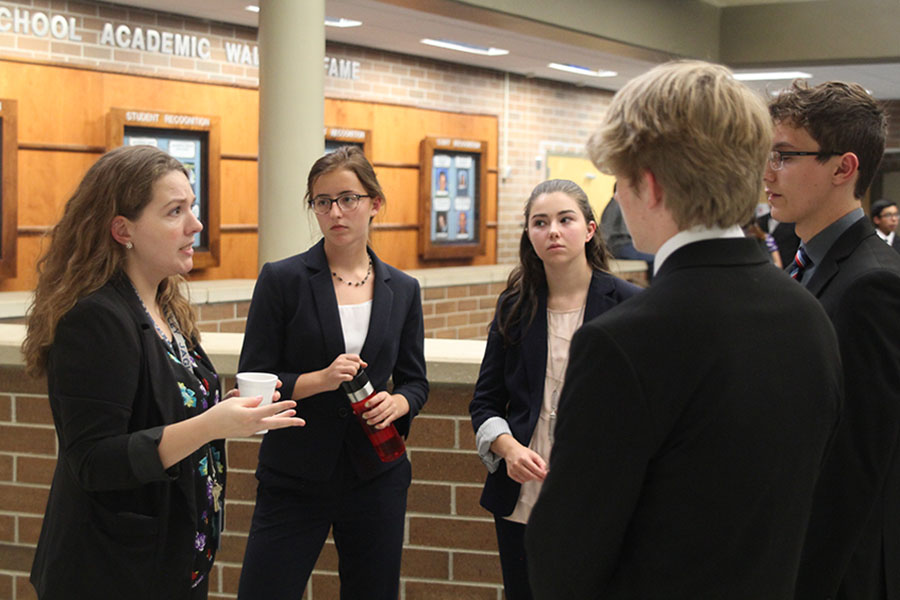 Debate coach Ann Goodson prepares the varsity debate team before the tournament at Washburn Rural High School on Friday, Sept. 15. I’m really enjoying Goodson’s teaching methods in the classroom, junior Lauren Rothgeb said. She’s doing a fabulous job of training everyone, and you can especially see that in the novices.