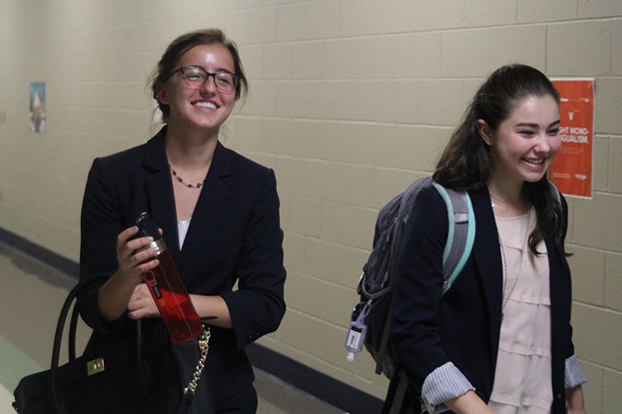 Senior Allison Winker and junior Lauren Rothgeb are all smiles as they return from a round on Friday, Sept. 15. There’s a lot of people who are really serious and really excited about debate, which is kind of new, Rothgeb said. There were people in previous years as well, but I just see a lot more.