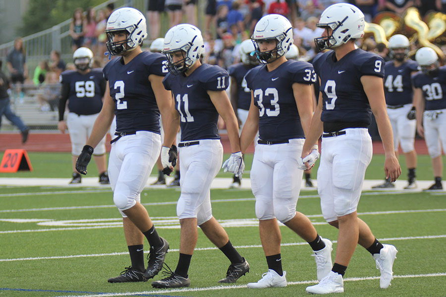 The Jaguars kick off their season on Friday, Sept. 1 against the St. James Thunder. Hand-in-hand, captains senior Ike Valencia, juniors Ben Hanson and Trevor Wieschhaus and senior Brody Flaming walk to the center of the field. 