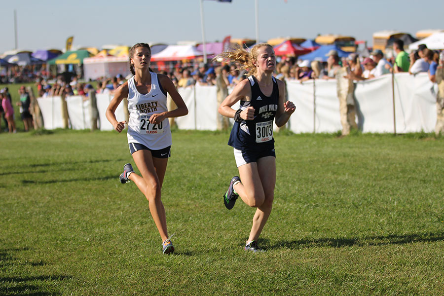 Running to the finish line, freshmen Molly Ricker pushes past the competition.