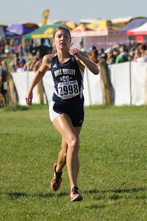 Finishing the race strong, senior Britton Nelson sprints.