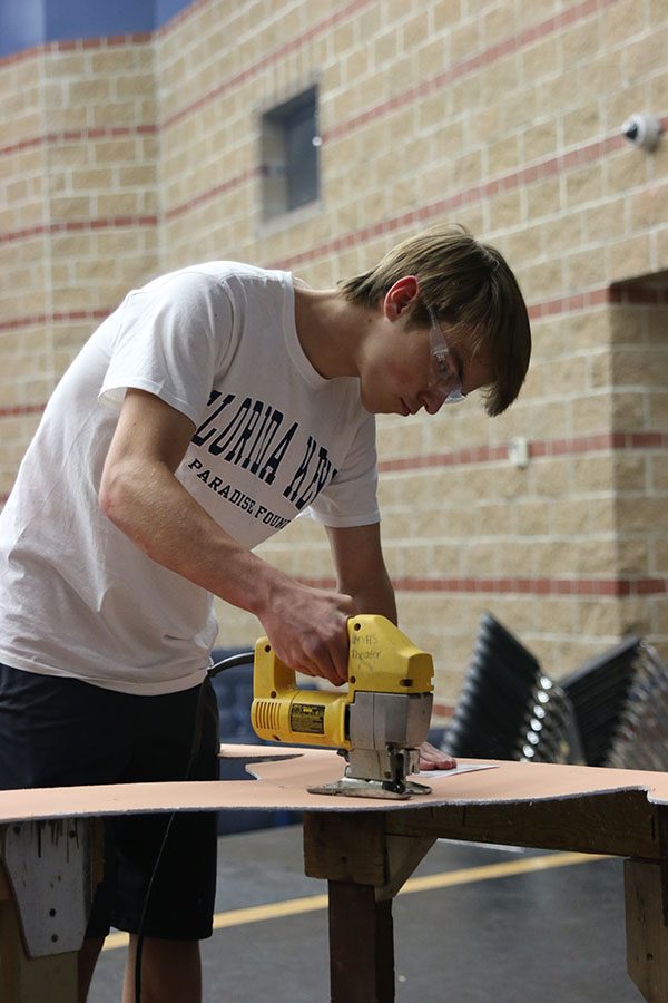 In Stagecraft class, senior Nathan Pettigrew uses a jigsaw on a piece of wood on Monday, Sept. 25. “My favorite part … is going into the theater and learning about all the different materials we use to build, Pettigrew said. It’s a lot more than you think.”