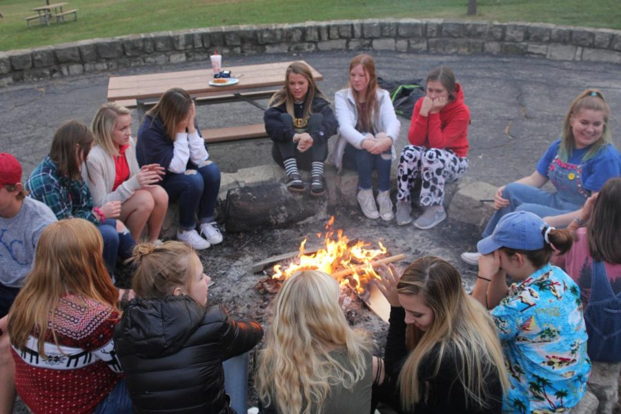 Gathered around the bonfire on Sunday, Oct. 29, members of MV Outfitters spend time with others who share a similar love of the outdoors.