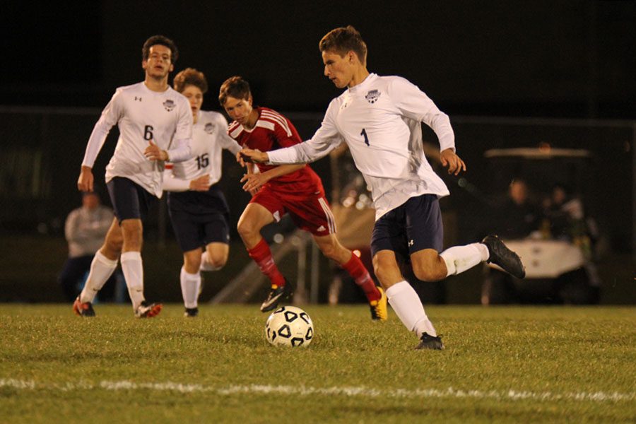 Junior Caleb Brown charges down the field looking to pass the ball to a teammate.
