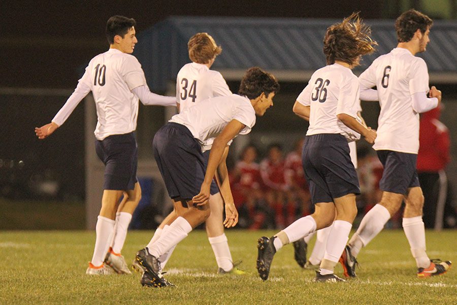 Running back to centerfield together after a goal is scored, the Jaguars celebrate as a team.