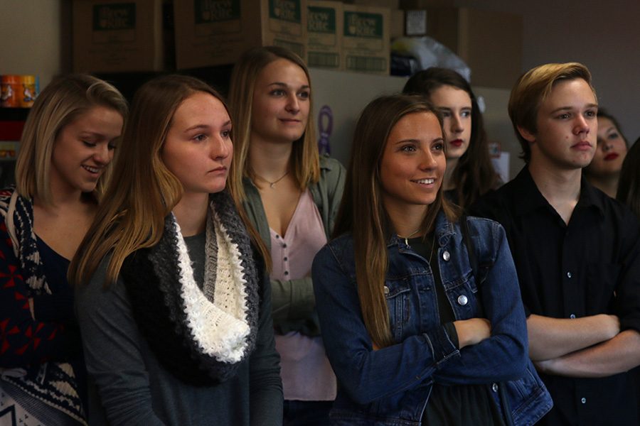 While touring part of the studio, seniors Hailey Stelle and Bailey Heffernon are given information by a Fox 4 News employee.