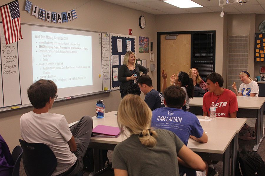 Addressing the class, consumer science teacher Emily Schmidt informs her students of their daily agenda.