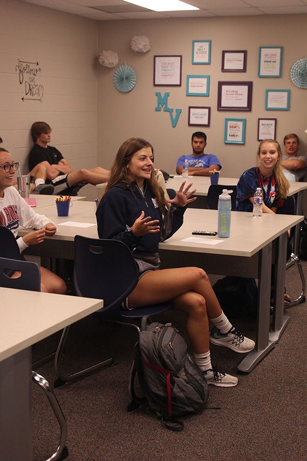 Participating in the daily ritual of good things, Junior Payton Totzke tells her class mates about her day.