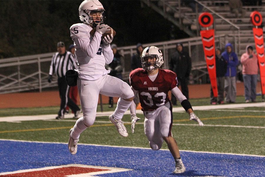 In the first round of playoffs, the Jaguars defeated the Topeka-Seaman Vikings on Friday, Oct. 27. Jumping in the endzone, junior Logan Tally catches a pass for a touchdown. 