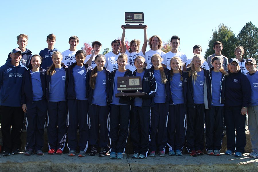 The boys and girls cross country teams, with coaches Chris McAfee, Betsy Meeks and Page Anderson, display their two second place trophies.