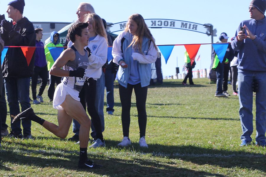Striding forward, sophomore Jack Terry continues his race.  Terry finished in 15th place.