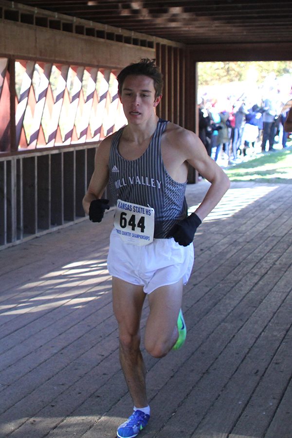 Crossing the bridge, junior Greg Haynes pushes through his race.  Haynes ended in 10th place.