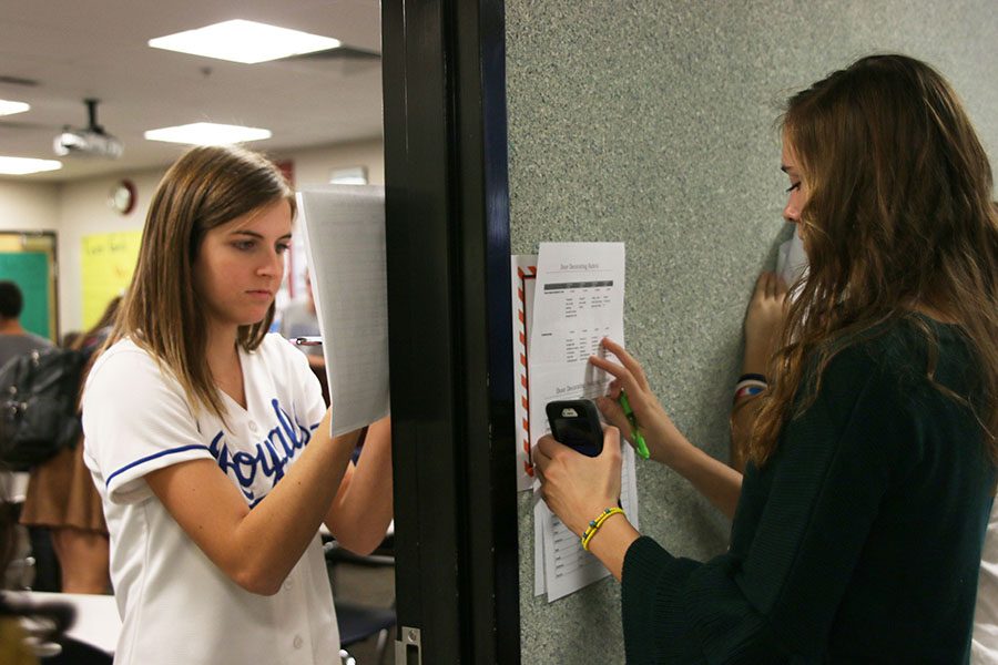 Juniors Jessie Leininger and Erin Miller judge the doors for Red Ribbon Week on Thursday, Oct. 26.