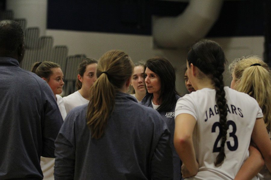 During a timeout, head coach Debbie Fay talks to the players during their game on Wednesday, Oct. 18 against Gardner. The Jaguars won two out of three matches, 26-24 and 25-20.
